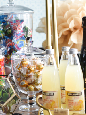 Oscar season is here and hosting a party can be easy, it's all about displaying those drinks and treats, some candy and champagne does the trick. find out more at www.homewithkeki.com