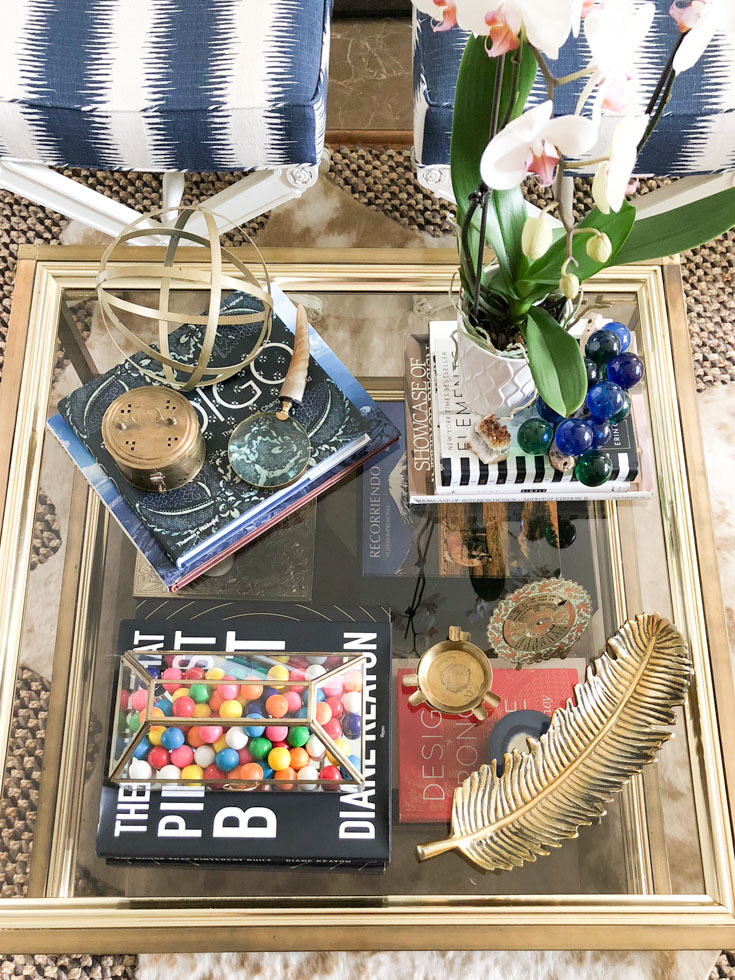 books and orchid on coffee table