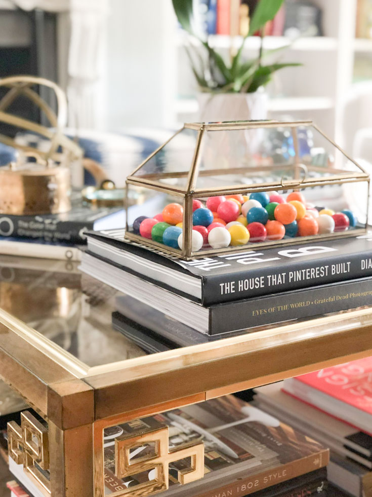 books and gold tray on coffee table