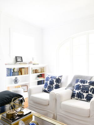 White living room with blue pillows