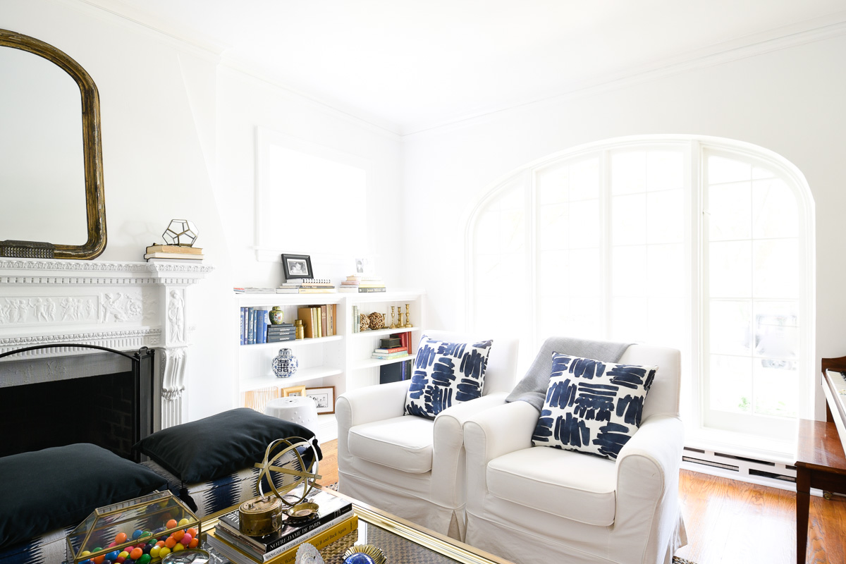 White living room with blue pillows